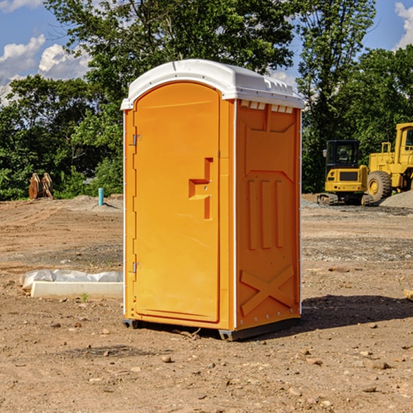 what is the cost difference between standard and deluxe portable restroom rentals in Trona